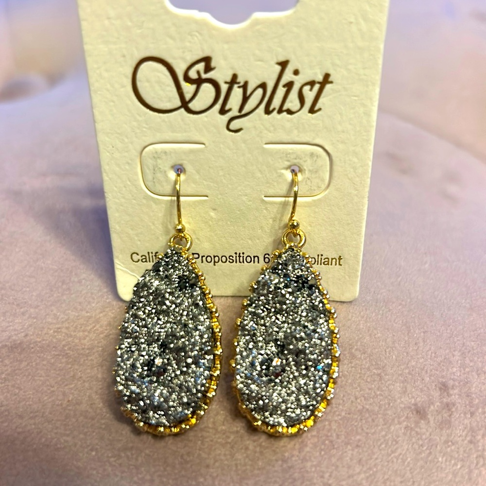 Chrome colored stone like earrings with gold trim